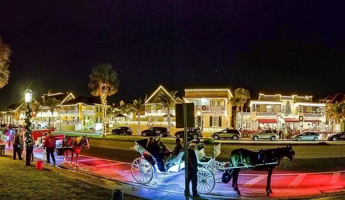 A horse-drawn carriage tour beneath the Nights of Lights holiday display in St. Augustine